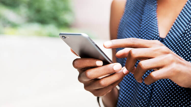 Close up of woman holding a smart phone