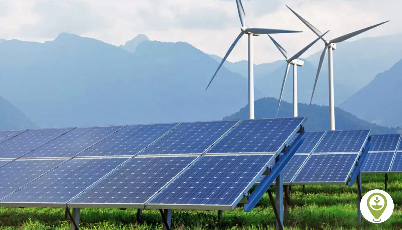 Wind turbines and solar cells at a renewable energy facility.